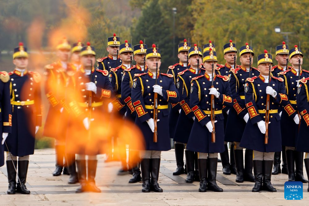 Soldiers of an honor guard stand in attention during a ceremony marking Romania's Army Day at the Tomb of the Unknown Soldier in Bucharest in Bucharest, Romania, Oct. 25, 2026. (Photo by Cristian Cristel/Xinhua)