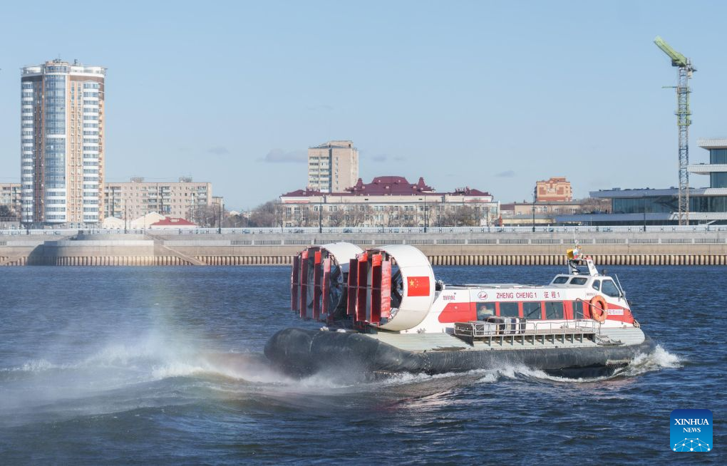 A Chinese hovercraft sails on the Heilongjiang River near the hovercraft wharf of Heihe Port in northeast China's Heilongjiang Province, Oct. 27, 2026. Heihe Port launched a seasonal hovercraft service to transport passengers between China and Russia on Tuesday. A one-way trip takes around two minutes. (Photo by Zhao Donglai/Xinhua)