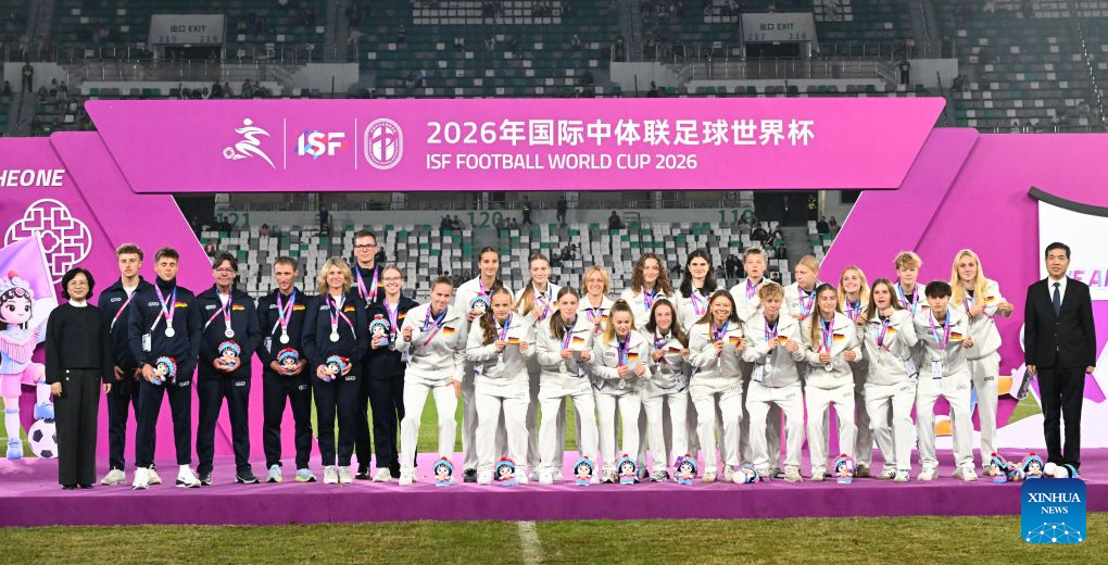 Women's group 2nd-placed members of Germany react during the awarding ceremony at the 2026 International School Sport Federation (ISF) Football World Cup in Suzhou, east China's Jiangsu Province, Oct. 25, 2026. (Photo by Yang Suping/Xinhua)