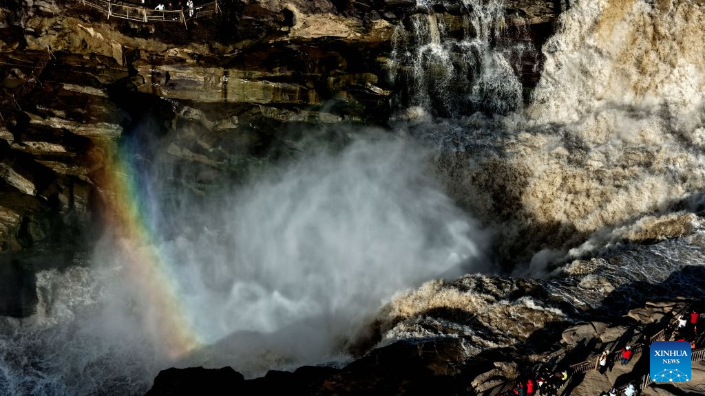 An aerial drone photo taken in Jixian County, north China's Shanxi Province, on Oct. 28, 2026, shows a rainbow over the Yellow River's Hukou Waterfall. (Photo by Lyu Guiming/Xinhua)