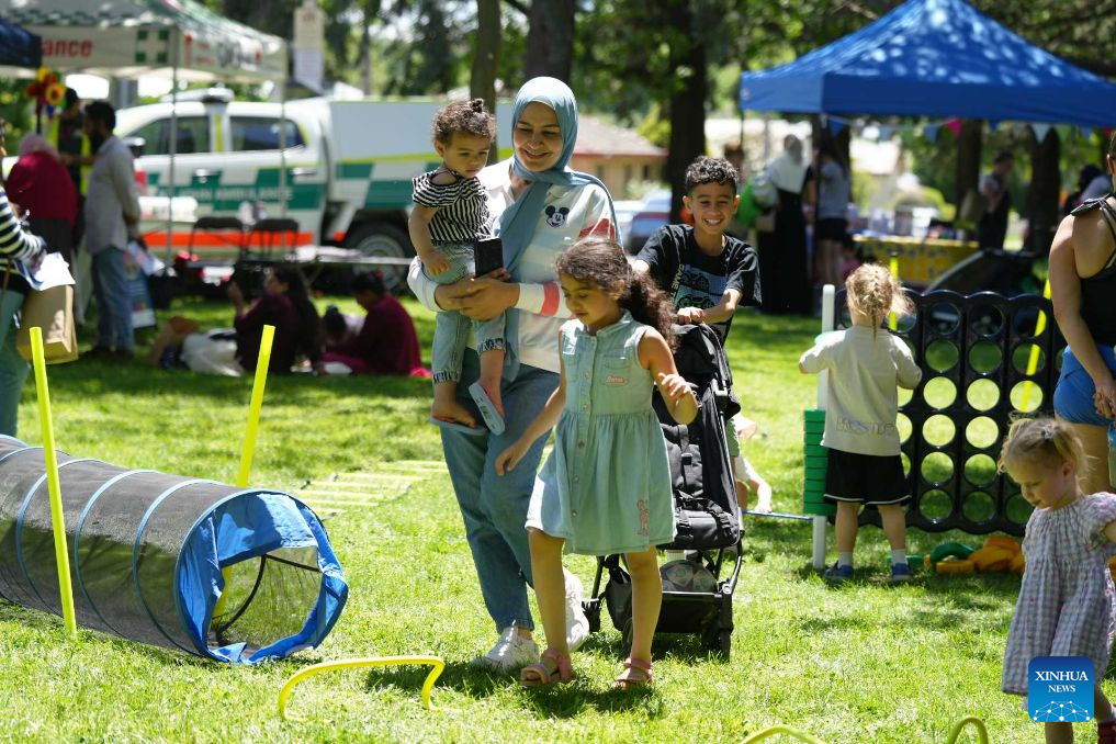 Children enjoy amusement activities during an event to celebrate Children's Week 2026 in New South Wales, Australia, on Oct. 24, 2026. Hundreds of children and their families gathered at Queanbeyan Park, near Australia's capital Canberra, on Saturday to celebrate Children's Week 2026. The event featured a range of activities for children and families, bringing the local community together to enjoy a day of fun and celebration. (Photo by Zhang Na/Xinhua)