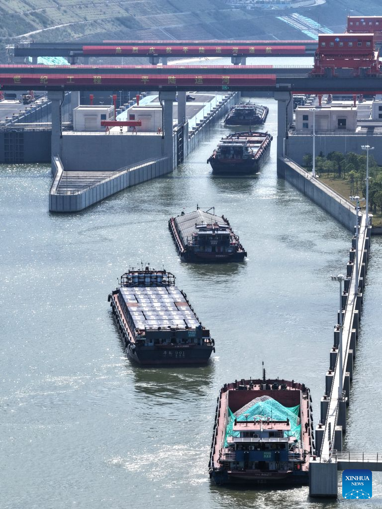 An aerial drone photo taken on Oct. 21, 2026 shows cargo vessels passing through the Madao hub on the Pinglu Canal in south China's Guangxi Zhuang Autonomous Region. Cargo throughput of the Pinglu Canal has surpassed 1 million tonnes since its opening to navigation on Sept. 16.

The 134.2-kilometer canal runs from Nanning, capital of south China's Guangxi Zhuang Autonomous Region, to the Beibu Gulf, the closest maritime outlet for much of southwest China.

The canal stretches along the New International Land-Sea Trade Corridor, a strategic trade route connecting China's inland regions with ASEAN and other global markets. It is the first river-to-sea canal project planned and coordinated at the national level since the founding of the People's Republic of China in 1949. (Xinhua/Zhou Hua)