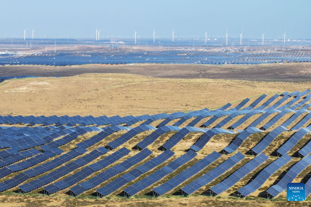 A drone photo taken on Oct. 21, 2026 shows a solar power base in Ningdong Town of Lingwu, northwest China's Ningxia Hui Autonomous Region. By the end of September 2026, China's cumulative installed capacity of wind and solar power reached 2.01 billion kilowatts, the country's National Energy Administration announced on Monday. Of the total, solar power capacity stood at 1.31 billion kilowatts, up 16.5 percent year on year, while wind power capacity reached 700 million kilowatts, up 20.4 percent. (Photo by Yuan Hongyan/Xinhua)