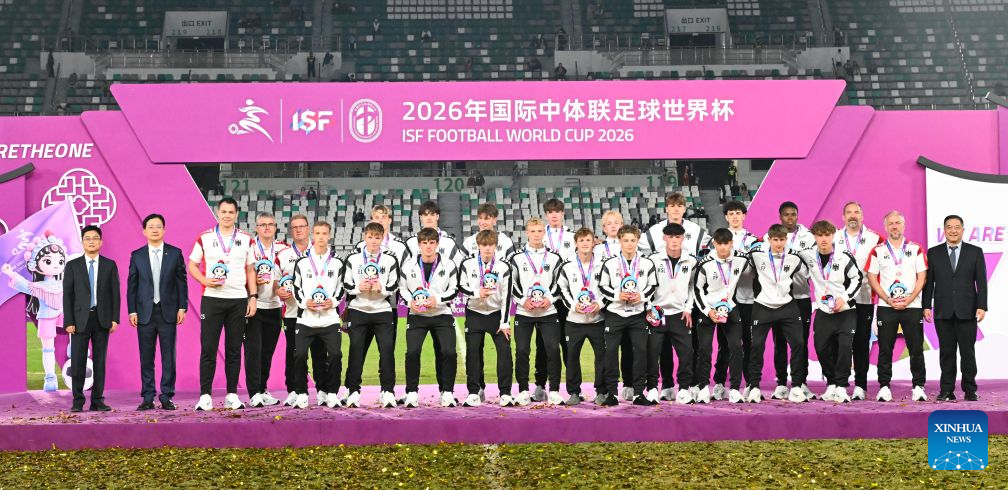 Men's group 3rd-placed members of Germany react during the awarding ceremony at the 2026 International School Sport Federation (ISF) Football World Cup in Suzhou, east China's Jiangsu Province, Oct. 25, 2026. (Photo by Yang Suping/Xinhua)