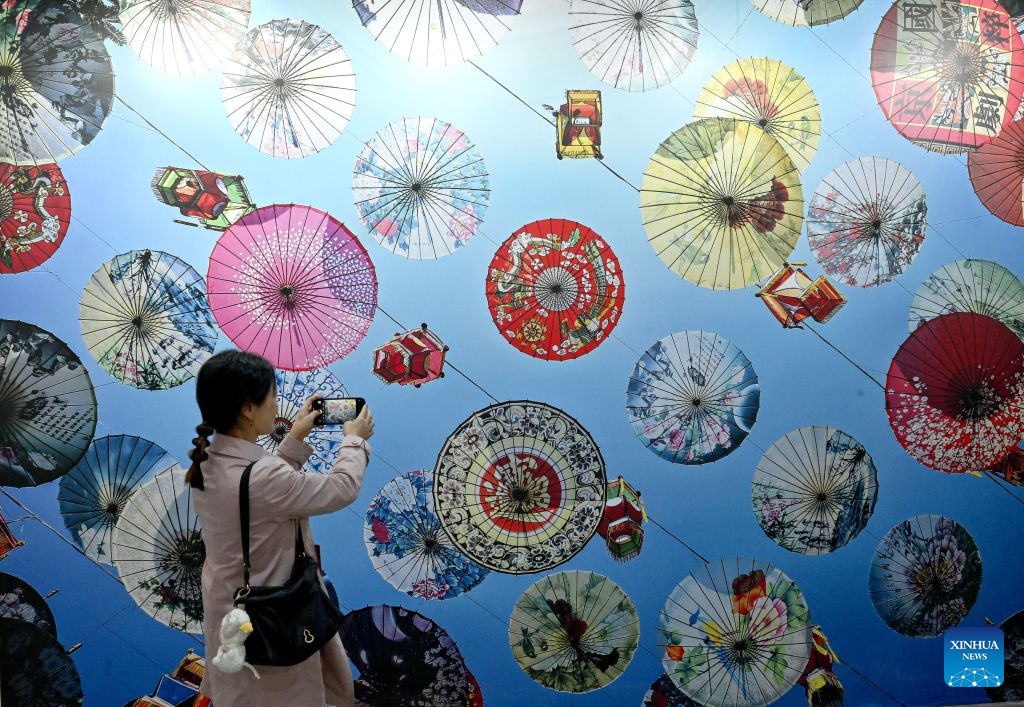 A visitor takes photos at an exhibition during the 16th China Photography Festival in Sanmenxia City, central China's Henan Province, Oct. 29, 2026. The 16th China Photography Festival kicked off here on Thursday, featuring exhibitions covering a variety of themes, including documentary and art. (Xinhua/Zhu Xiang)