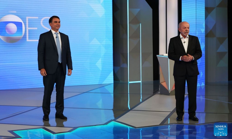 Brazilian President Luiz Inacio Lula da Silva (R), presidential candidate of Brazil's ruling Workers' Party, attends a televised debate with Brazilian Senator Flavio Bolsonaro, presidential candidate of Brazil's Liberal Party, in Rio de Janeiro, Brazil, Oct. 23, 2026. 