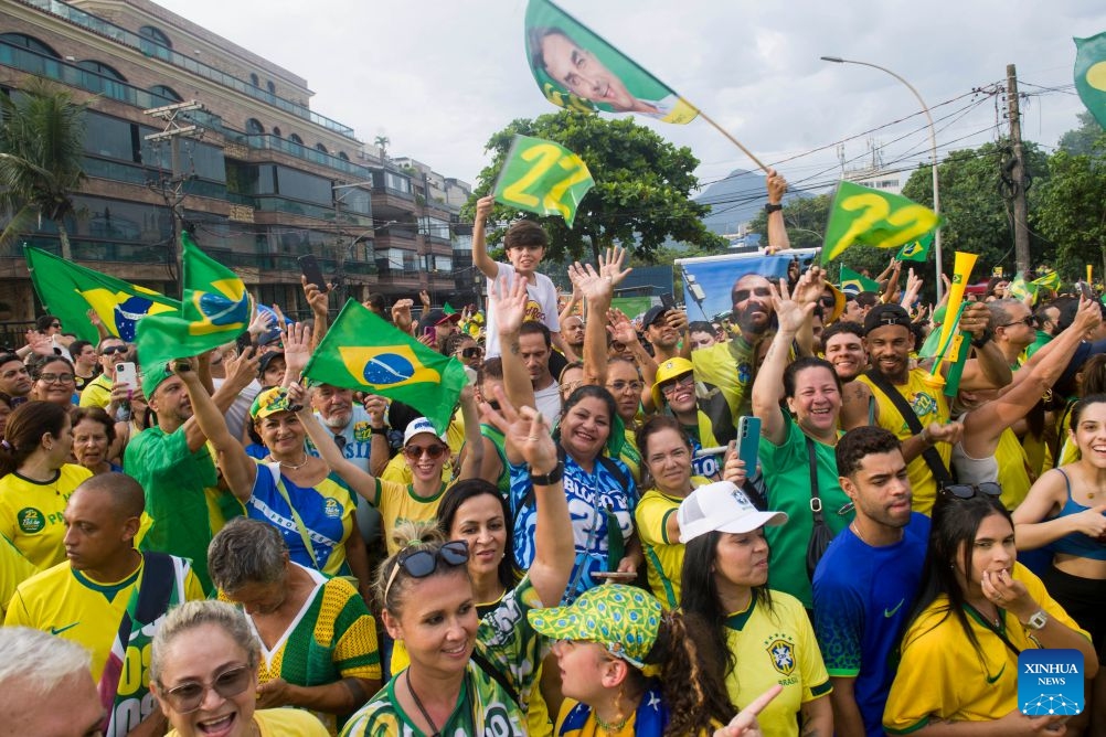 Supporters attend a presidential campaign rally of Brazilian Senator Flavio Bolsonaro, presidential candidate of Brazil's Liberal Party, in Rio de Janeiro, Brazil, Oct. 24, 2026. Brazilian incumbent President and presidential candidate of Brazil's ruling Workers' Party Luiz Inacio Lula da Silva, and presidential candidate of Brazil's Liberal Party Flavio Bolsonaro held the last campaign rally on Saturday in Sao Paulo and Rio de Janeiro, respectively. The second round of voting for Brazil's 2026 presidential election will be held on Sunday. (Photo by Daniel Ramalho/Xinhua)