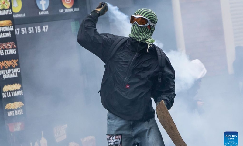 A protester is seen in Lille, France, Oct. 24, 2026. Around 410,000 people took part in a new round of protests across France on Saturday, French news channel BFM TV reported, citing the Interior Ministry. (Photo by Sebastien Courdji/Xinhua)