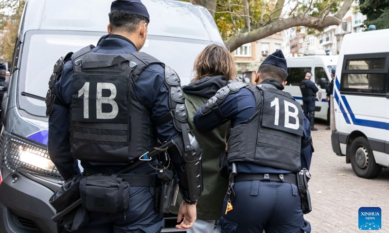 Security personnel take away a protester in Lille, France, Oct. 24, 2026. Around 410,000 people took part in a new round of protests across France on Saturday, French news channel BFM TV reported, citing the Interior Ministry. (Photo by Sebastien Courdji/Xinhua)