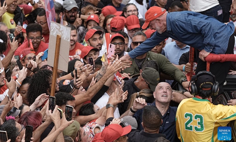 Brazilian President Luiz Inacio Lula da Silva (upper right), presidential candidate of Brazil's ruling Workers' Party, attends a presidential campaign rally in Sao Paulo, Brazil, Oct. 24, 2026. Brazilian incumbent President and presidential candidate of Brazil's ruling Workers' Party Luiz Inacio Lula da Silva, and presidential candidate of Brazil's Liberal Party Flavio Bolsonaro held the last campaign rally on Saturday in Sao Paulo and Rio de Janeiro, respectively. The second round of voting for Brazil's 2026 presidential election will be held on Sunday. (Photo by Paulo Lopes/Xinhua)