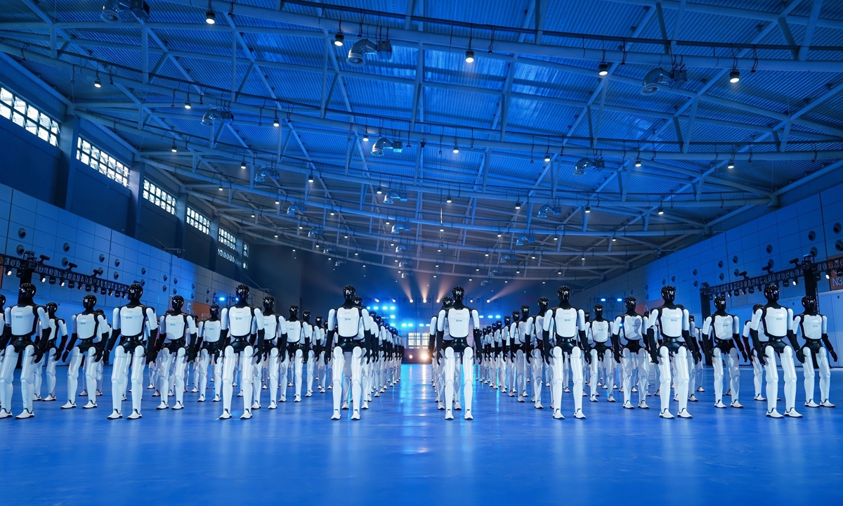 110 Expedition A3 humanoid robots perform synchronized dance routines and formation changes at a Guinness World Record challenge event at the Yellow River International Convention and Exhibition Center in Jinan, East China's Shandong Province, on October 24, 2026. (See story on Page 11) Photo: Courtesy of AgiBot