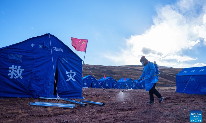 A staff member sanitizes the tents area at a quake-hit village in Maru Township of Baqen County, Nagqu City, southwest China's Xizang Autonomous Region, Oct. 24, 2026. As of 11 a.m. Saturday, 52,450 items or sets of disaster relief supplies had been sent to the quake zone, while more than 2,500 rescue personnel were engaged in relief operations.
Authorities have established 35 temporary resettlement sites in the disaster zone. Medical treatment and public health and epidemic prevention efforts are proceeding in an orderly manner, according to the local emergency command headquarters. (Xinhua/Tenzin Nyida)