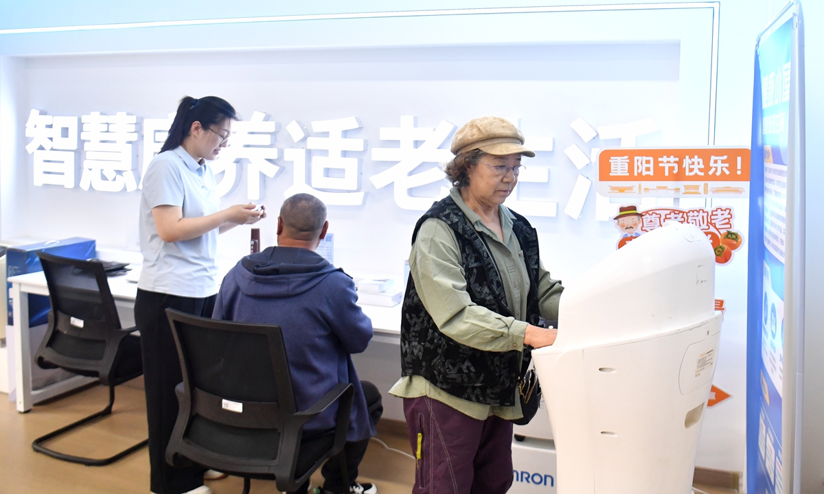 A community holds an event to assist elderly residents, focusing on their practical needs in digital use and home-based care in Xiong'an, Hebei, on October 16, 2026.