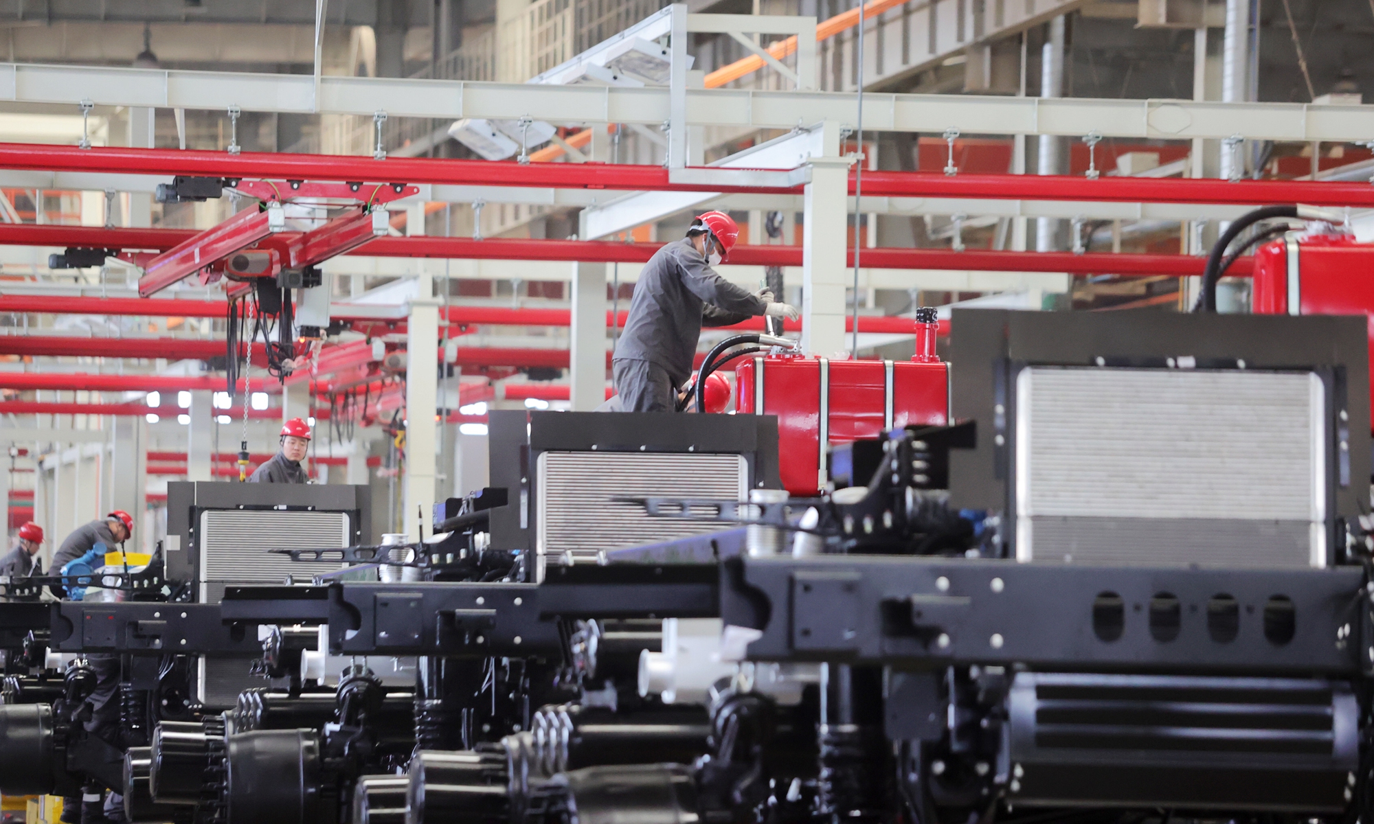 Workers operate on the production line at an intelligent workshop in Yangzhou, East China's Jiangsu Province on April 22, 2026. Photo: VCG