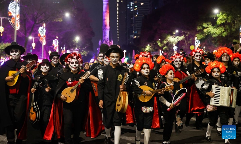 People take part in the Catrinas Parade in Mexico City, capital of Mexico, Oct. 25, 2026. The Catrinas Parade was held on Sunday ahead of the Day of the Dead. (Xinhua/Ding Hongfa)