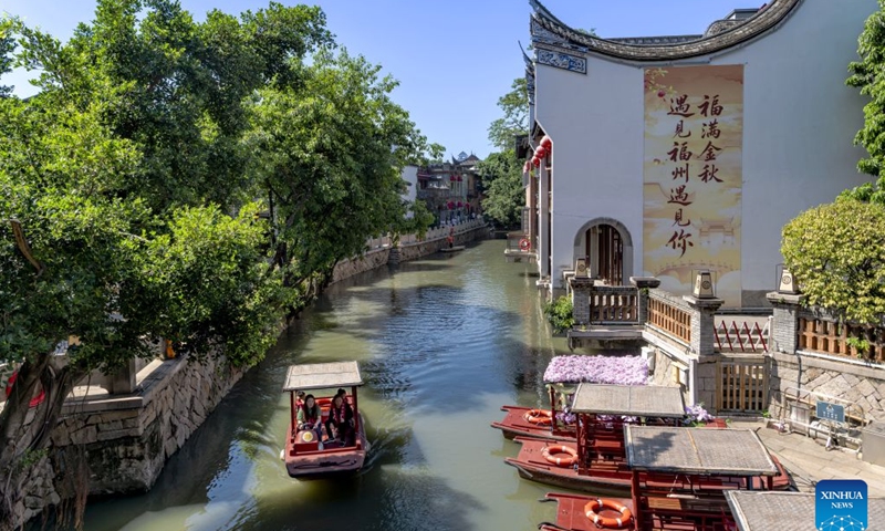 Tourists take a boat to enjoy the scenery at the Shangxiahang traditional block in Fuzhou, southeast China's Fujian Province, Oct. 7, 2026. Fuzhou, located on the coast of the East China Sea and the banks of the Minjiang River, is a renowned historical city with a history of over 2,200 years. Relying on its natural endowments and cultural heritage, Fuzhou has coordinated urban renewal, ecological governance, cultural heritage preservation and other aspects to promote high-quality and sustainable urban development. (Xinhua/Wei Peiquan)