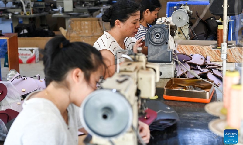 Workers process leather accessories at a leather processing factory in Hucun Village of Xingye County, Yulin City, south China's Guangxi Zhuang Autonomous Region, Oct. 30, 2026. Since the beginning of this year, Xingye County has been implementing a six improvements program in villages, focusing on the practical improvements in manufacturing, agricultural industry, green space, road access, water facilities, and streetlights. These measures are creating fresh momentum for rural revitalization. (Xinhua/Cao Yiming)

